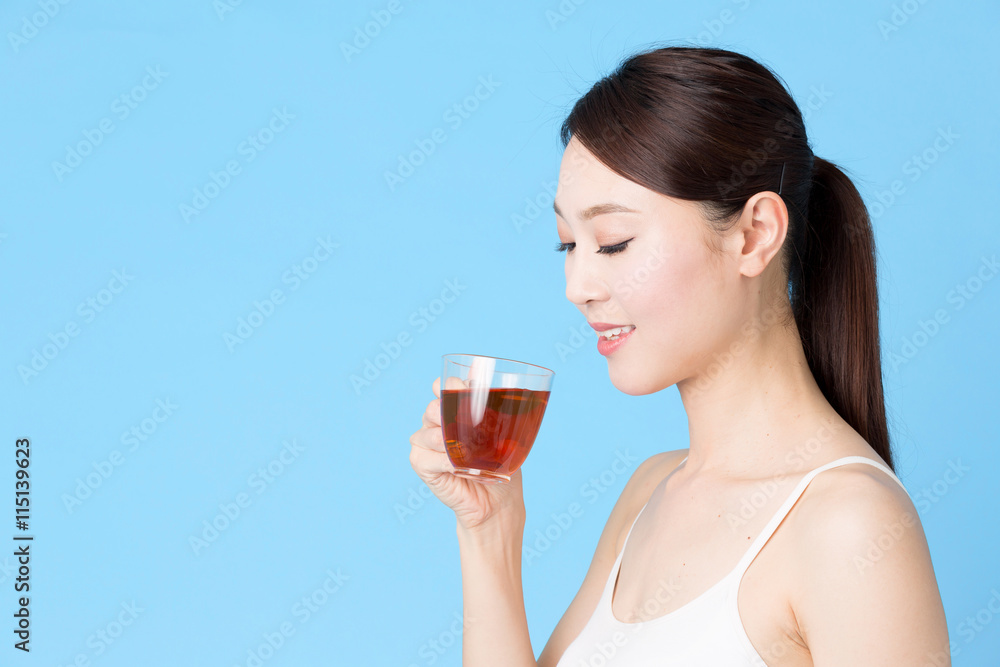 attractive asian woman isolated on blue background attractive asian woman isolated on blue background