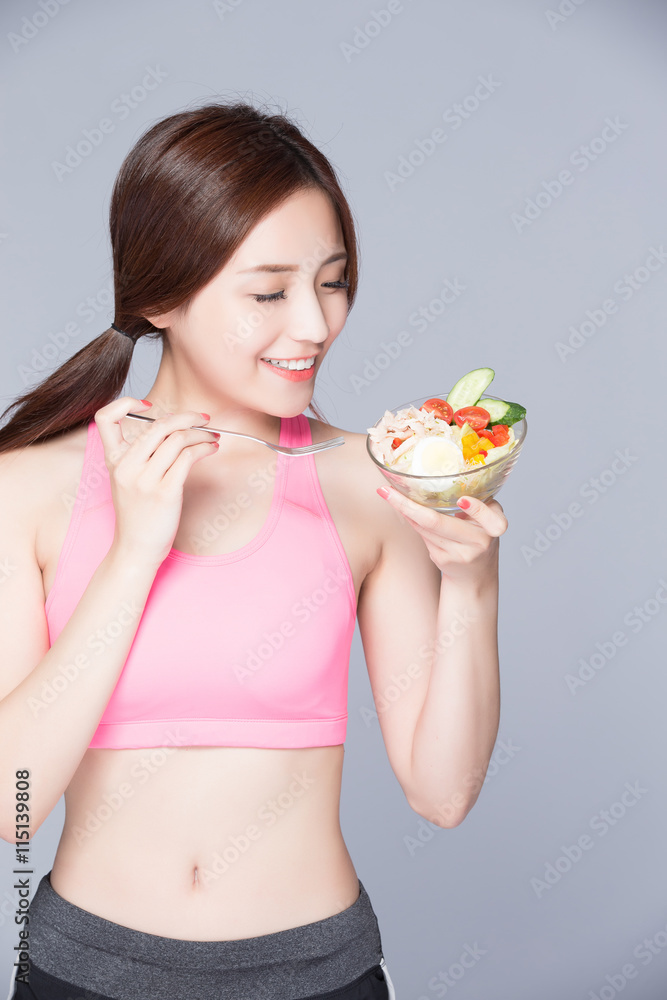 woman eat salad and smile woman eat salad and smile