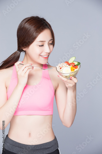 woman eat salad and smile