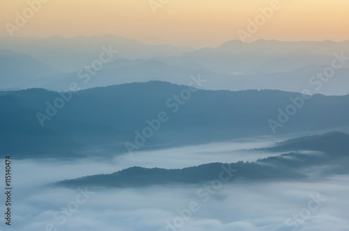 Beautiful morning with fog between hills. © n.ko.studios
