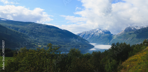 Fototapeta Naklejka Na Ścianę i Meble -  Classic norwegian scandinavian summer mountain landscape view with mountains, fjord, lake with a blue sky, Norway