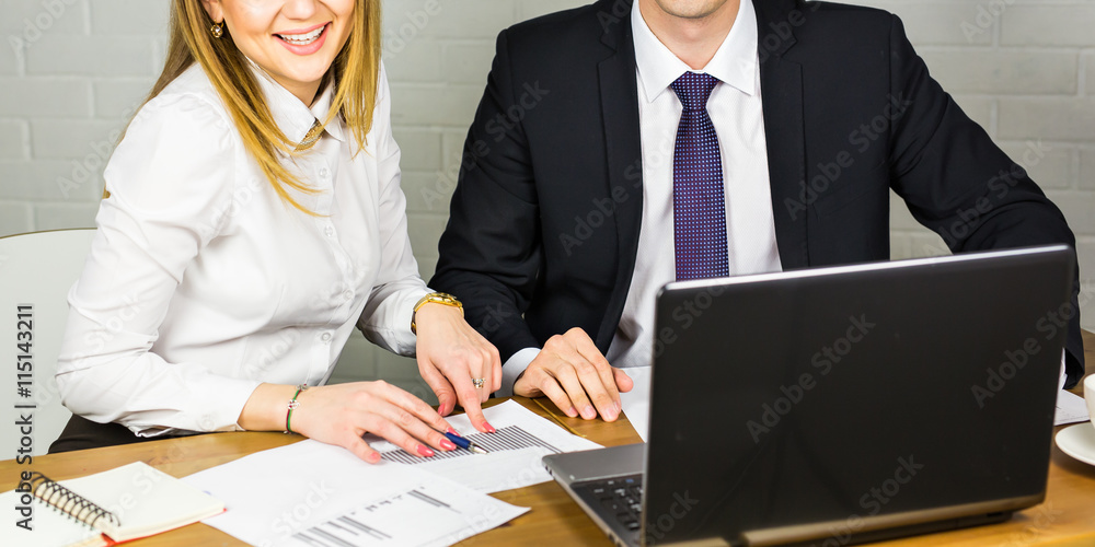 Close-up of male and female office workers. Close-up of male and female office workers.
