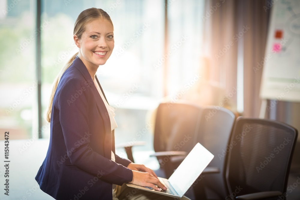Businesswoman using laptop