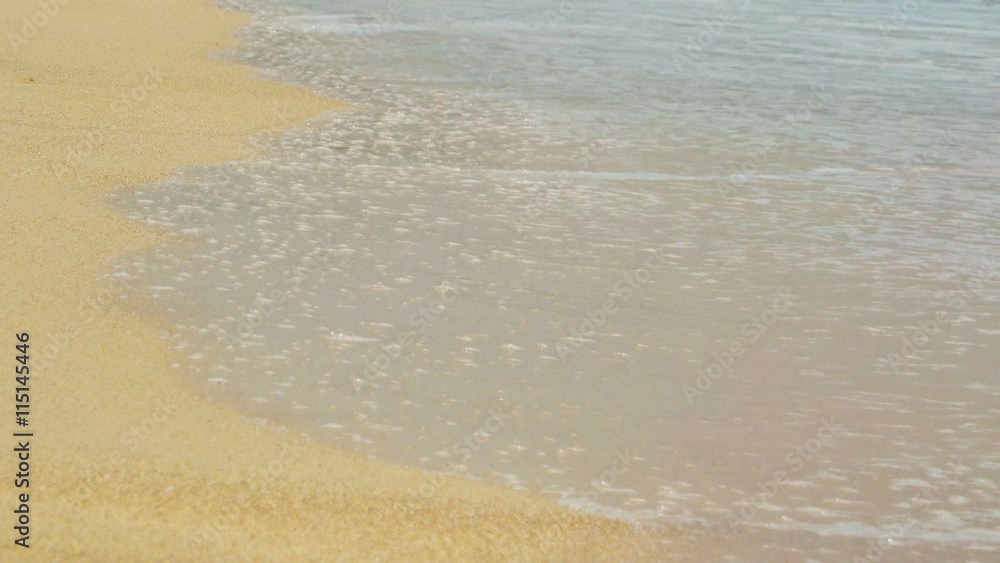 Tiny crab inches his way towards the surf on a beautiful, sandy tropical beach with gentle waves and sea foam. Video 4k Tiny crab inches his way towards the surf on a beautiful, sandy tropical beach with gentle waves and sea foam. Video 4k