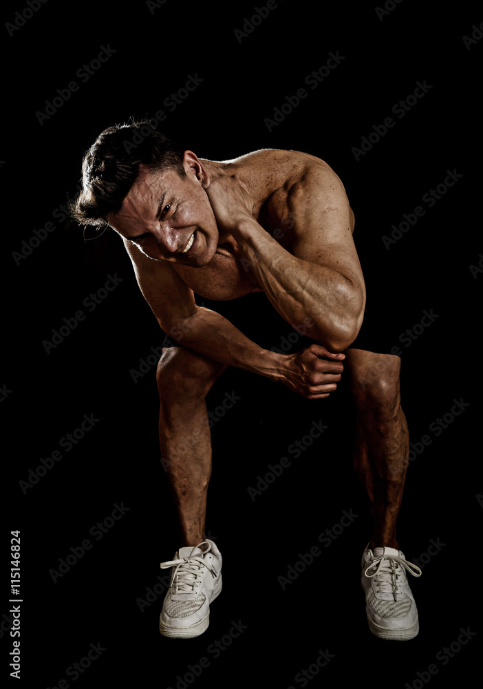 strong fit man with ripped body doing squat exercises showing defined  shoulders and biceps Stock Photo