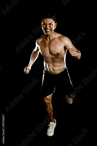 strong fit man with ripped body muscles running determined hard doing sprint workout naked torso