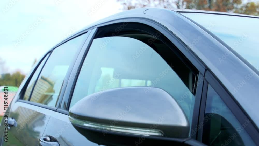 Slowmotion opens window of car Slowmotion opens window of car