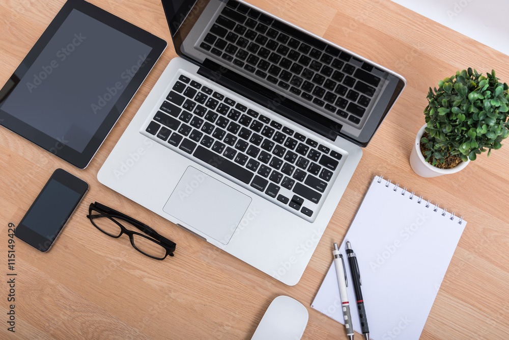 Top view open laptop with digital tablet and white smartphone Top view open laptop with digital tablet and white smartphone
