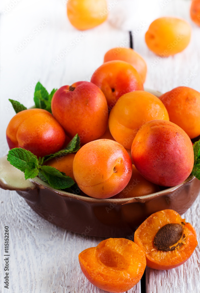 Ceramic bowl with organic ripe apricots