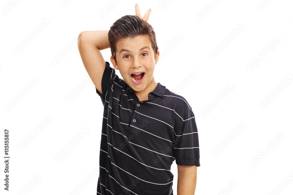 Playful kid making bunny ears on himself Playful kid making bunny ears on himself