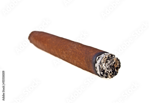 Brown cigar burned on white background