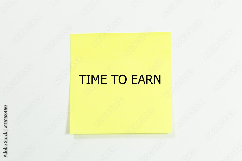 TIME TO EARN word written on yellow sticky notes. TIME TO EARN word written on yellow sticky notes.