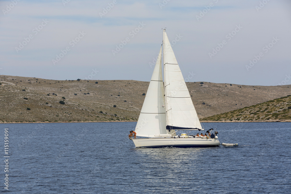A small sailboat at sea in Kornati National Park.
