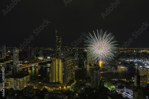 Bangkok cityscape, View high building at the Chaophraya river with fireworks in the Festival.