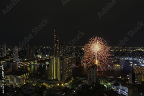Bangkok cityscape, View high building at the Chaophraya river with fireworks in the Festival. © hoylordz