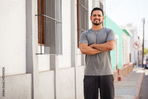 Hispanic runner doing some exercise outdoors © AntonioDiaz