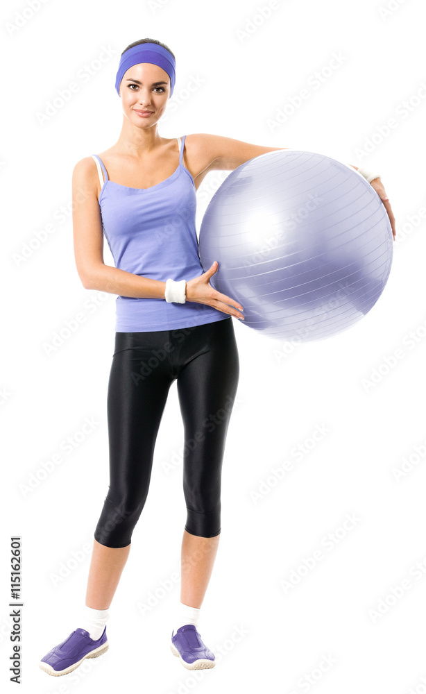 Full body portrait of smiling woman holding fitness pilates ball Full body portrait of smiling woman holding fitness pilates ball