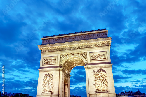 The famous Arc de Triomphe in Paris at dawn photo