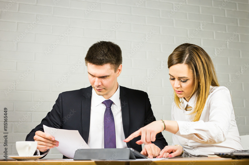 business couple working together on project at office business couple working together on project at office