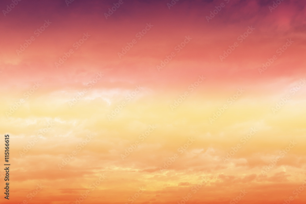 Orange sunset sky with clouds.