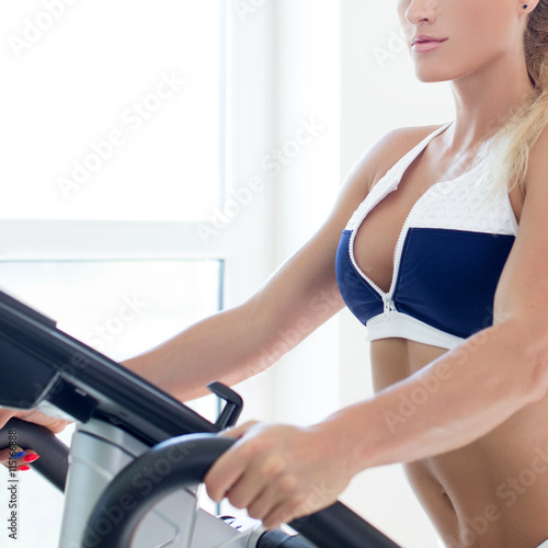 Woman on treadmill in gym