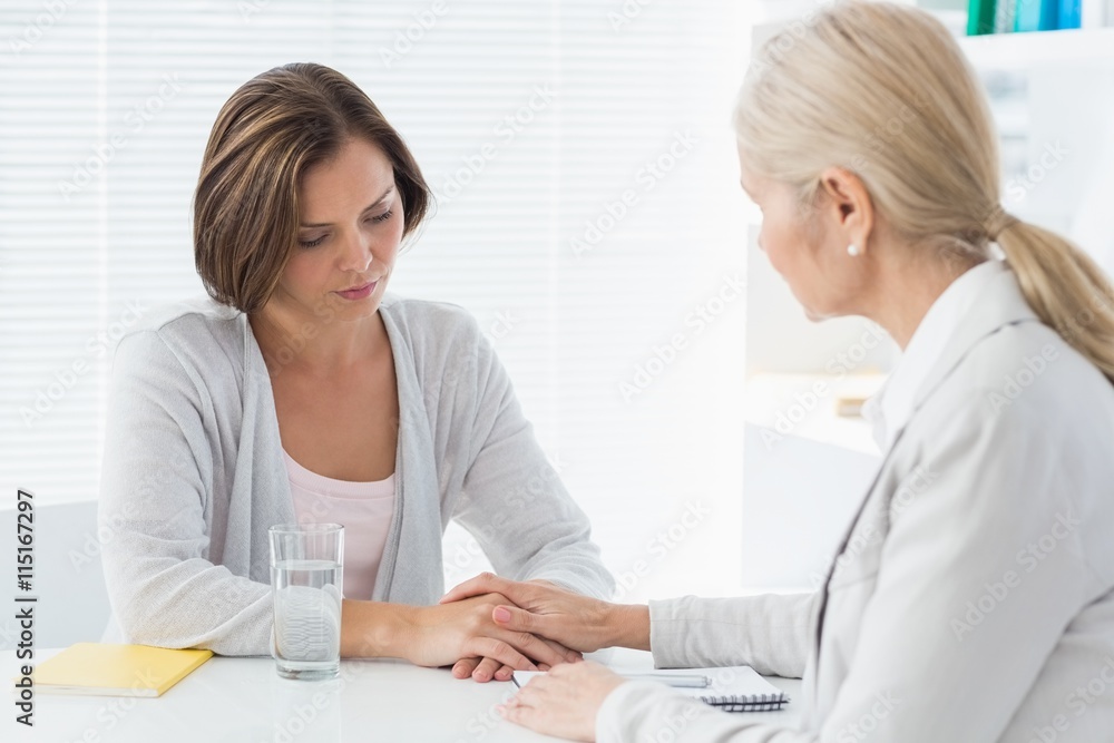 Therapist comforting her patient