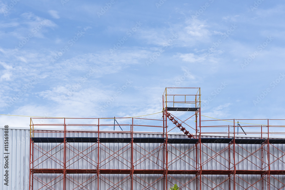 The red scaffold at the factory building between renovate proces The red scaffold at the factory building between renovate proces