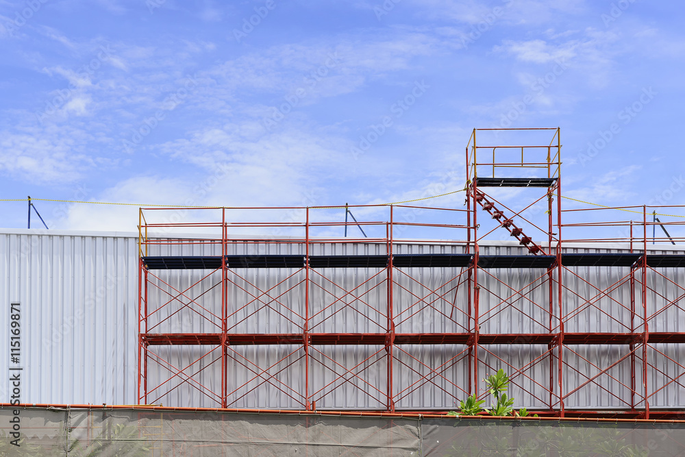 The red scaffold at the factory building between renovate proces The red scaffold at the factory building between renovate proces