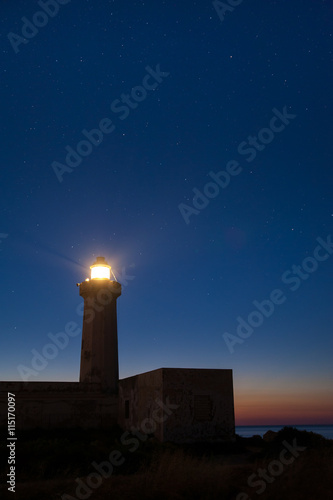 The lighthouse of Syracuse before the dawn against a starry sky