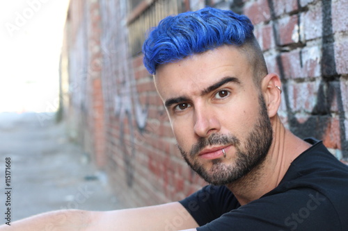 Fotografija Handsome stylish young man with artificially coloured blue dyed hair undercut ha