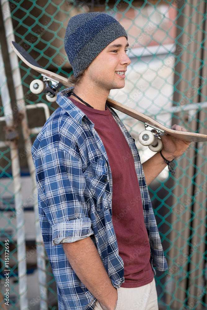 Handsome guy with skateboard