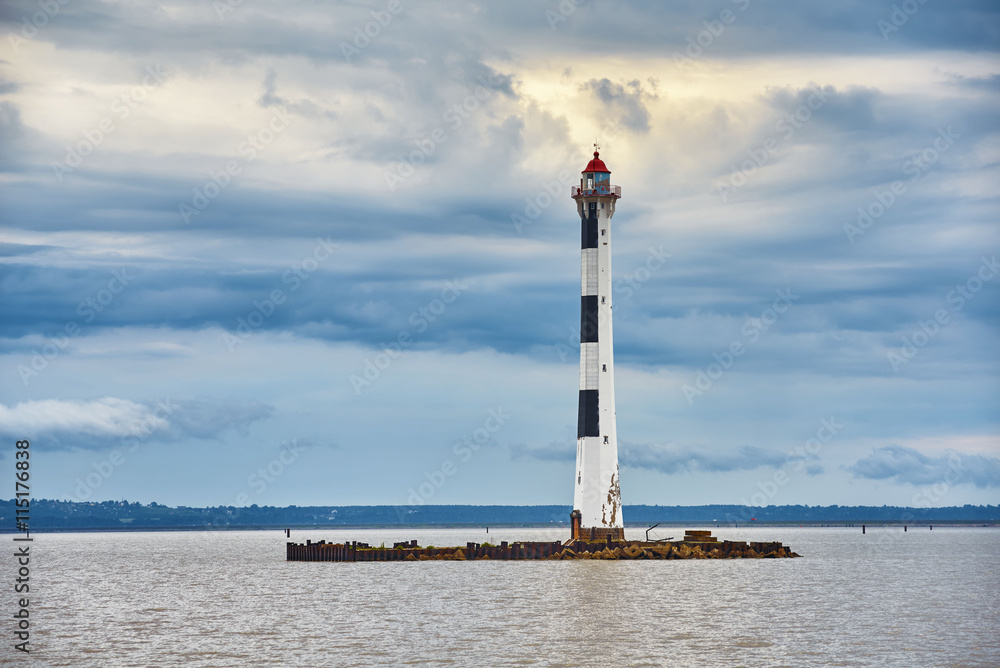 Casement Lighthouse in the Bay of Kronstadt on front of dramatic sky Casement Lighthouse in the Bay of Kronstadt on front of dramatic sky
