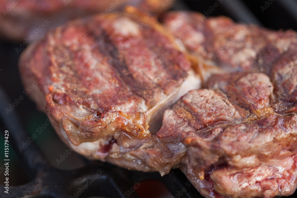 Ribeye steak on a grill Ribeye steak on a grill