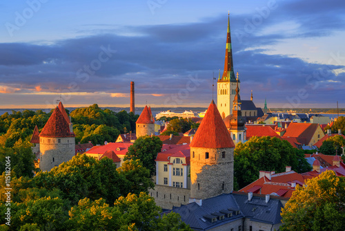Medieval churches and towers in the old town of Tallinn, Estonia photo
