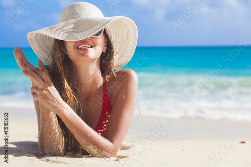 portrait of glamorous long haired woman at beach