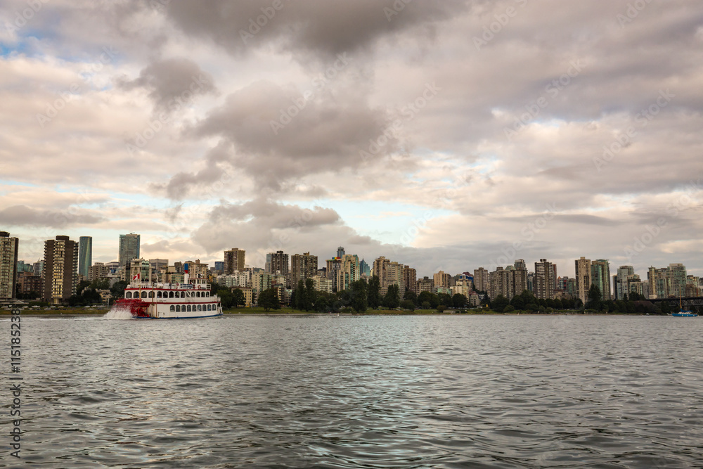 View of Downtown Vancouver with Stern-Wheeler going towards False Creek. Taken on a cloudy evening before sunset.