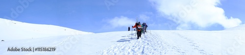 A group of tourists on a snowy mountain