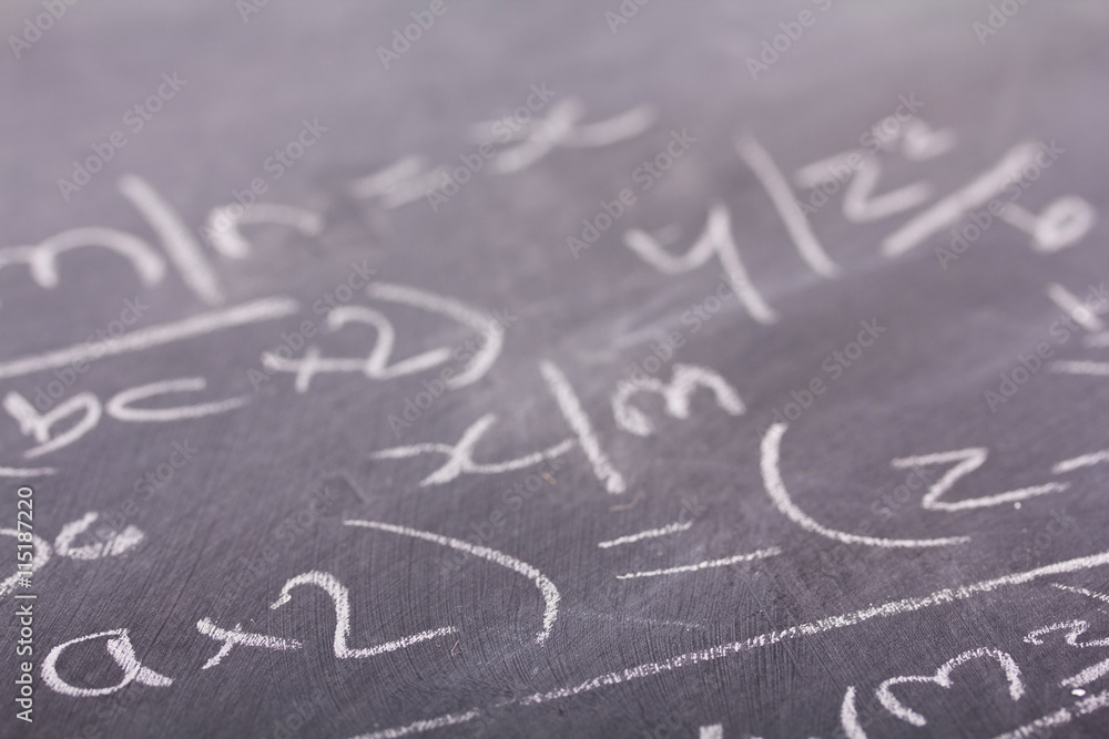 Fototapeta premium Close up of blackboard with maths equations
