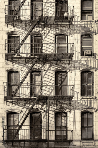Photography Typical old New York City building with fire escape ladders (antique look proces
