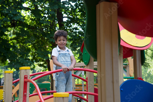 afro american school boy plays on playground © vasilisa_k