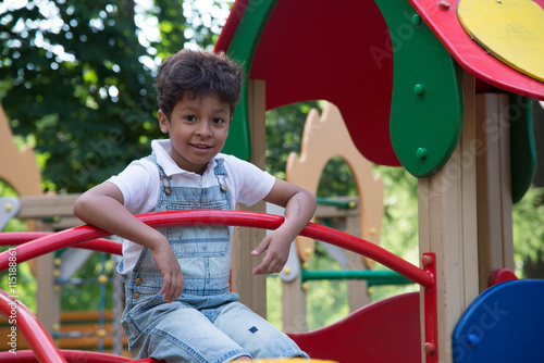 afro american school boy plays on playground © vasilisa_k