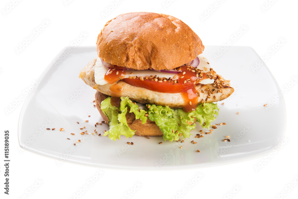 Burger with grilled chicken fillet isolated on white background Burger with grilled chicken fillet isolated on white background