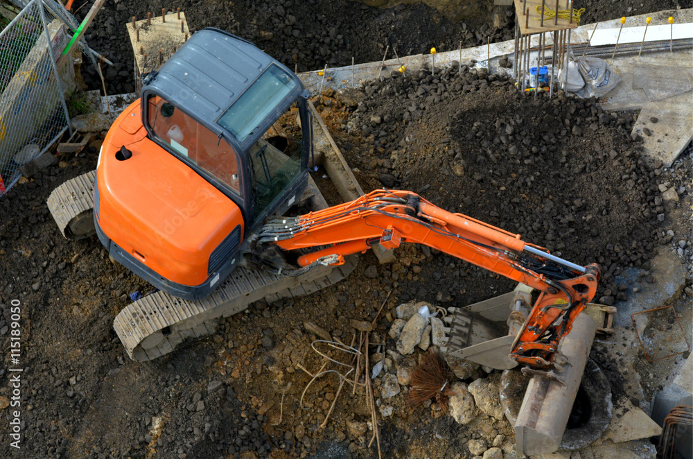Aerial view of excavator in a construction site Aerial view of excavator in a construction site