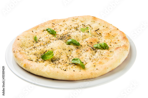 Quattro fromaggi pizza with basil isolated on white background