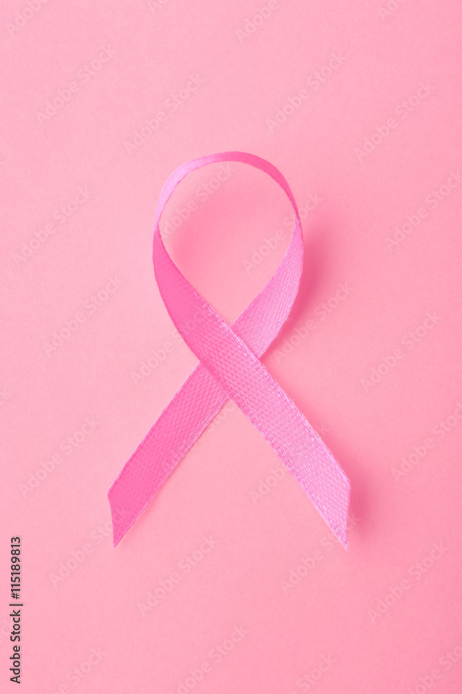 Satin ribbon symbol on pink background Satin ribbon symbol on pink background
