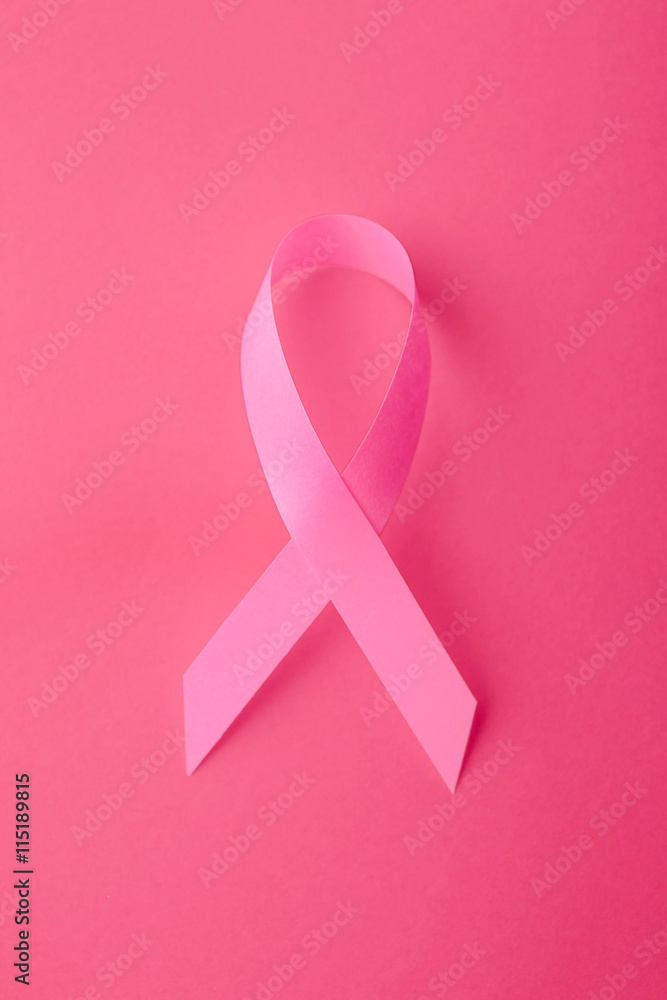 Satin ribbon symbol on pink background Satin ribbon symbol on pink background