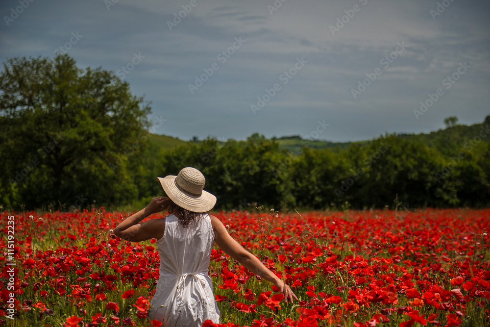 Woman in a poppies field