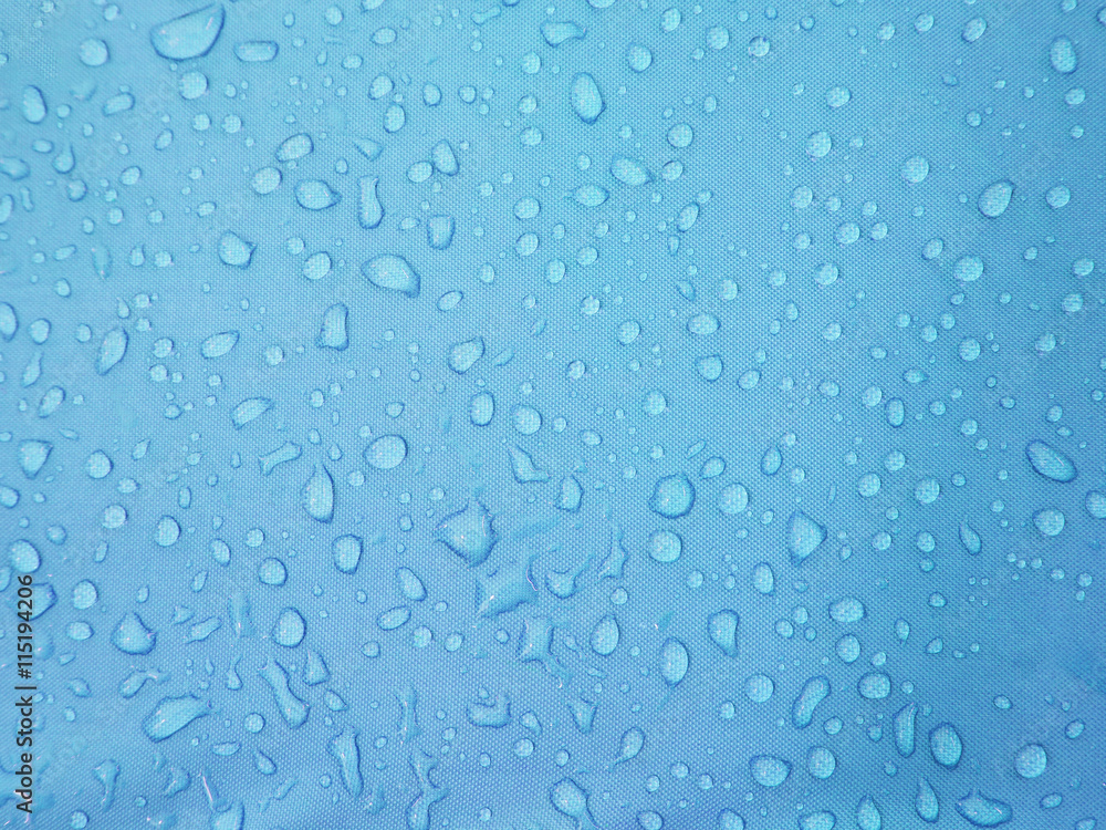water drops on blue waterproof fabric