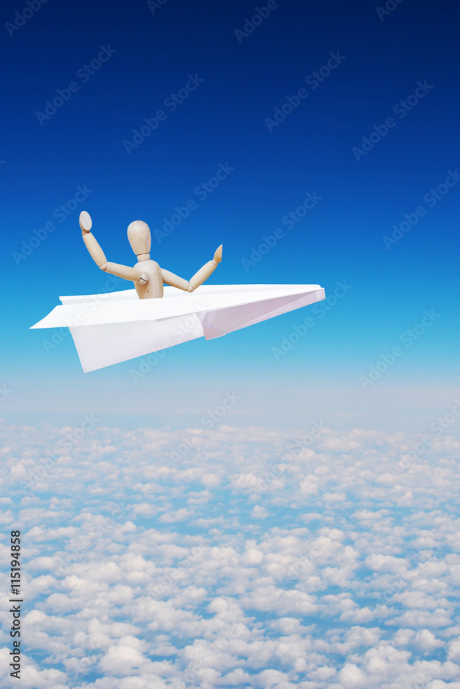 Man flies high over clouds in the toy paper plane