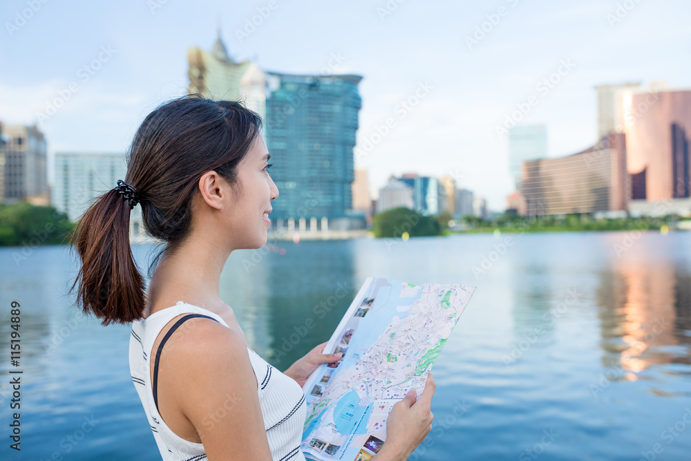 Woman using city map in Macau